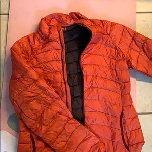 Burnt orange colored puffer jacket